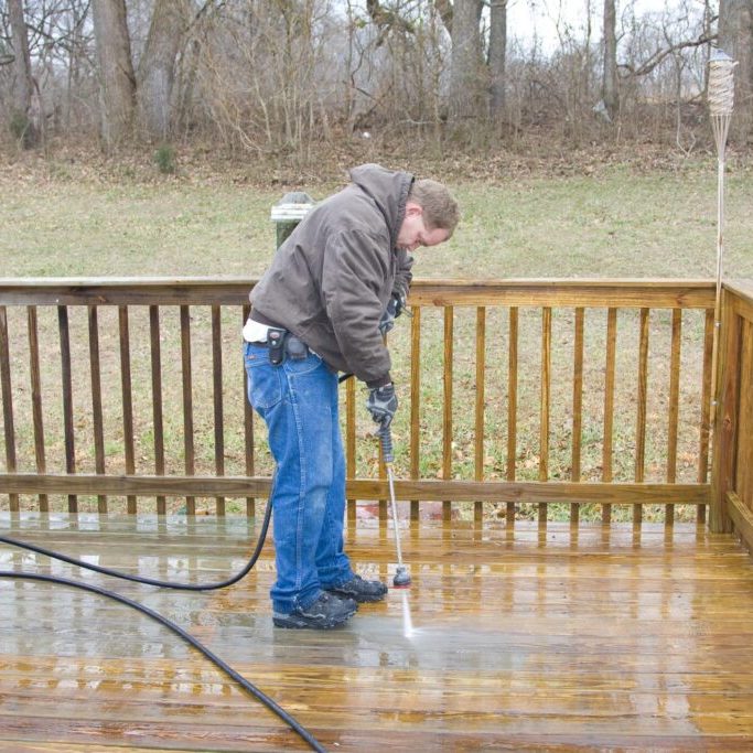 man cleaning the deck